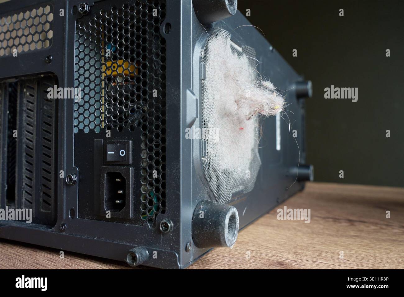 Dust and lint clog mesh vent on back of desktop computer case. PC ...