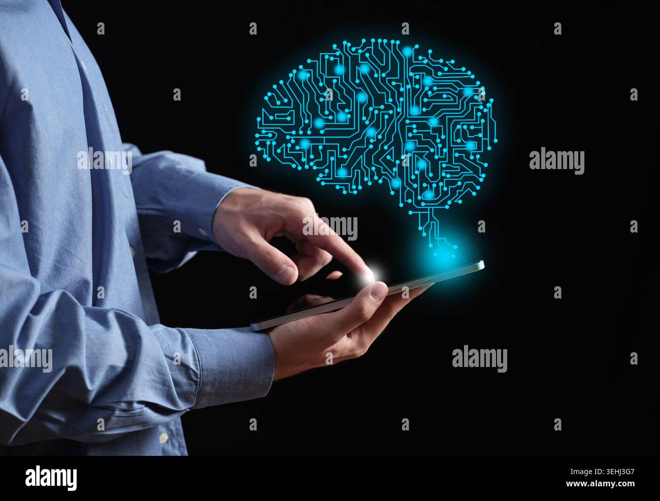 Person using a touchscreen tablet, connecting with a glowing circuit board brain representing artificial intelligence, machine learning and innovation Stock Photo