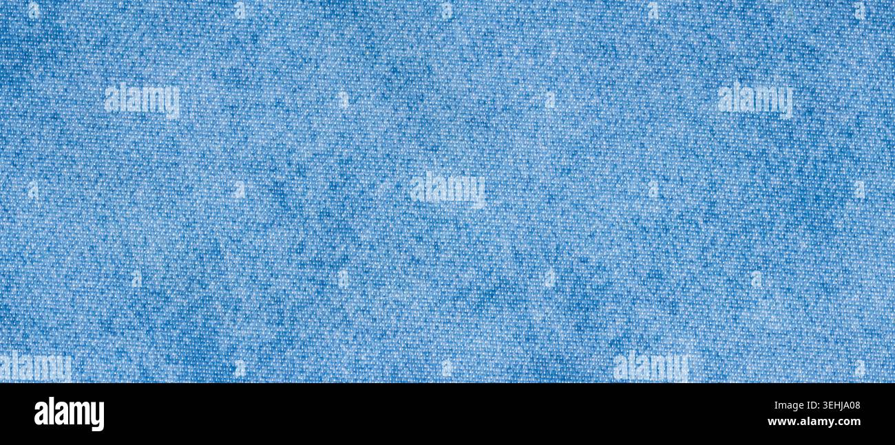 Light blue denim fabric texture background with woven jeans pattern for casual textile backdrop Stock Photo
