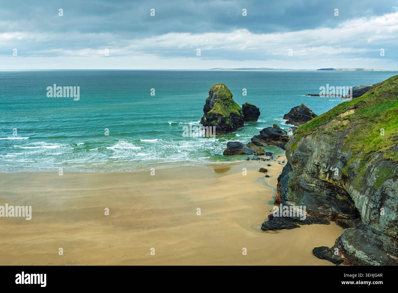 Wide panoramic view of Nuns' Beach and Virgin Rock sea stack with limestone cliffs in Ballybunion, Kerry, Ireland. Stock Photo