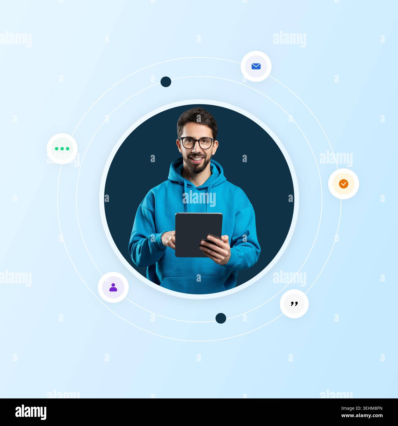 Young Man Using a Tablet While Interacting With Digital Icons in a Modern Setting Stock Photo