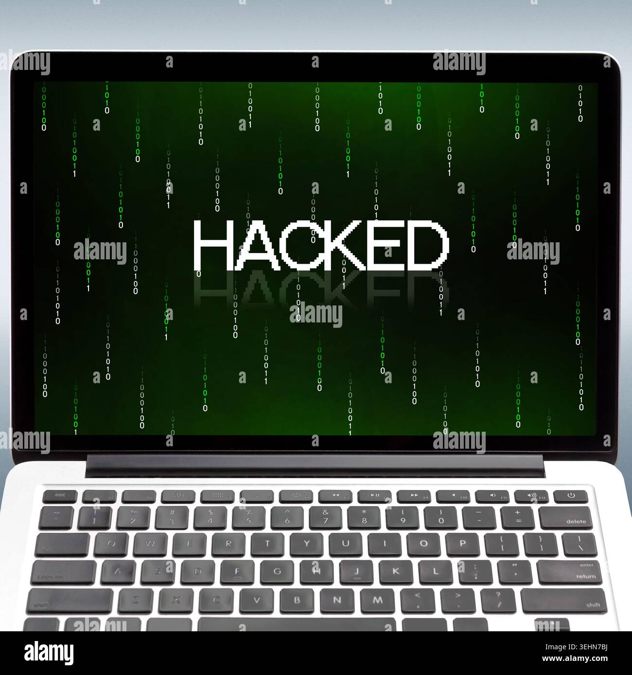 Laptop with inscription hacked and binary digits on screen Stock Photo