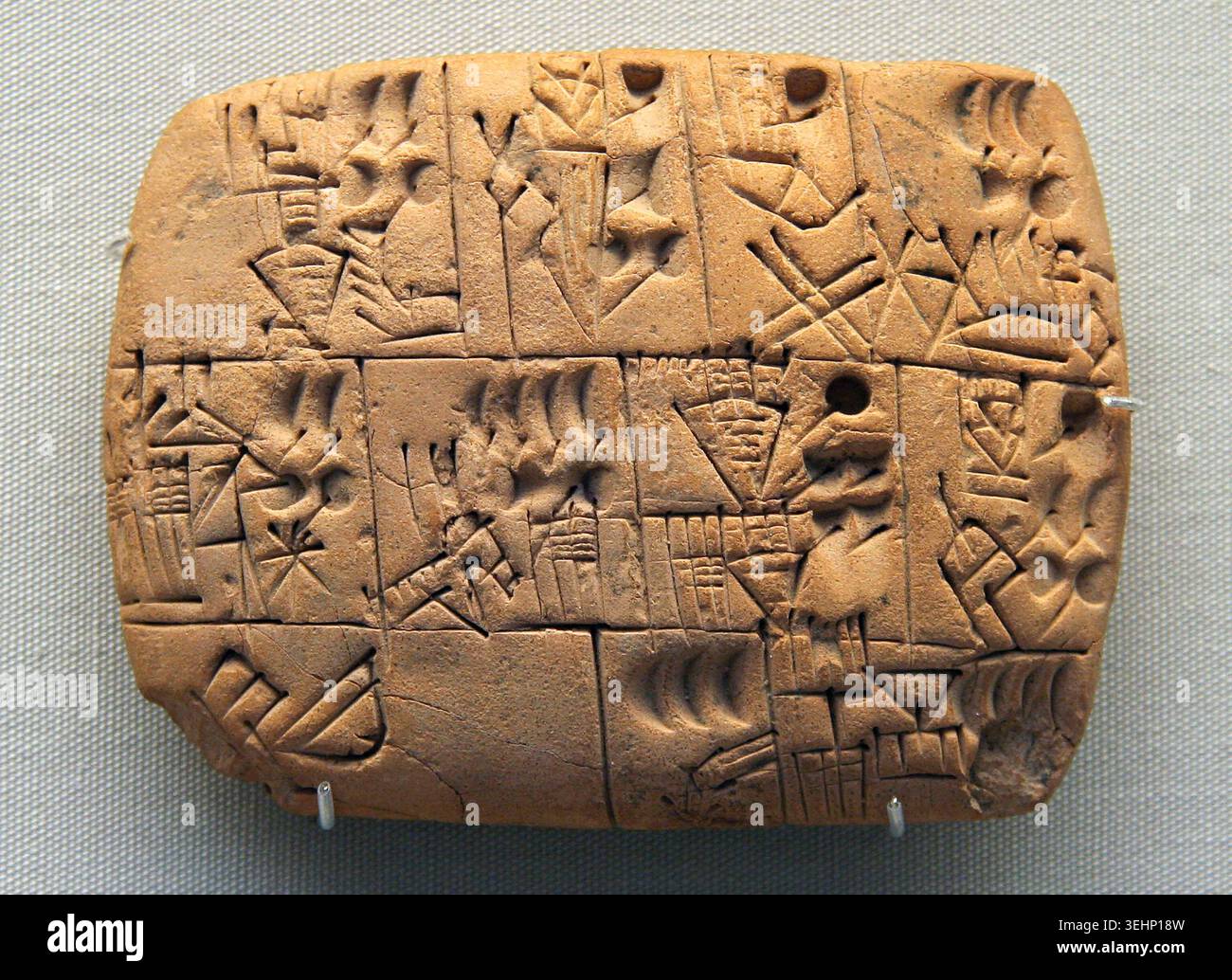 Clay accounting tablet with cuneiform writing from ancient Mesopotamia ...
