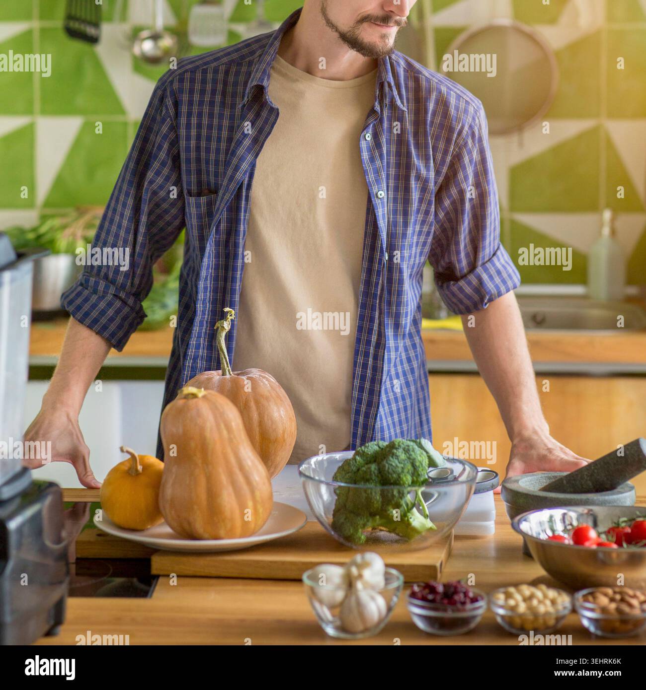 Unrecognizable young man preparing vegetables for cooking Stock Photo