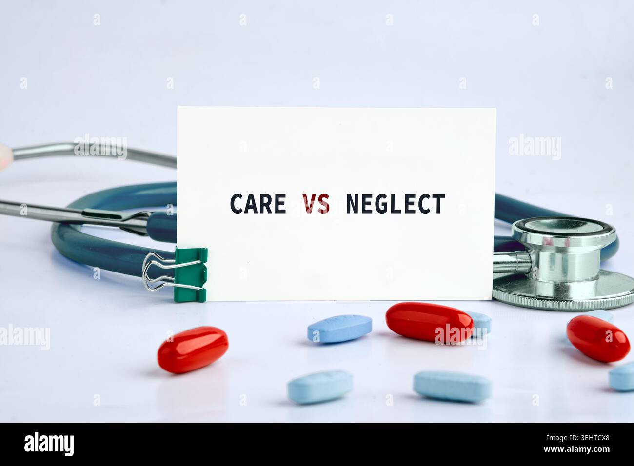 The words CARE VS NEGLECT are written on a white card, accompanied by a ...