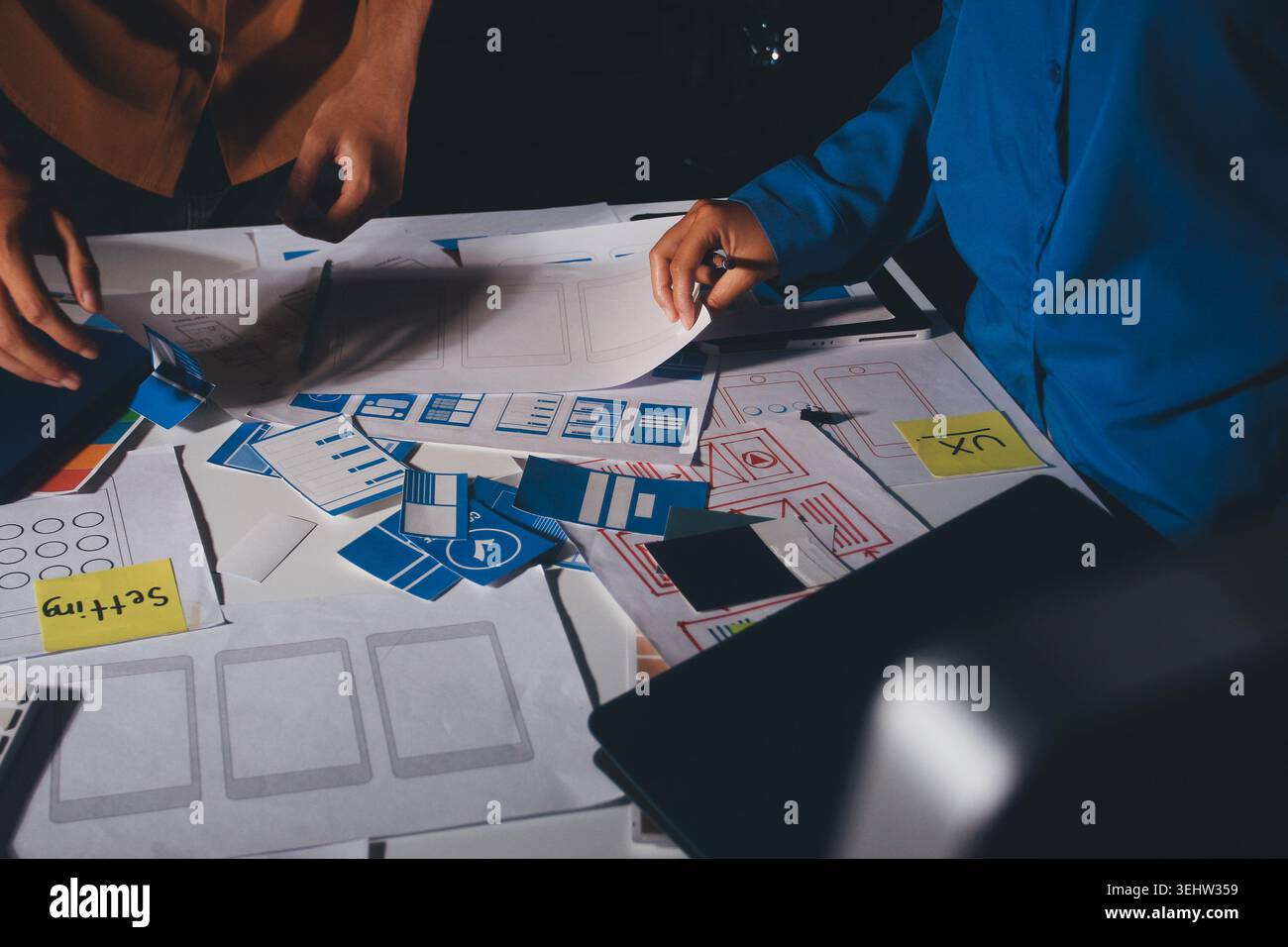 UXUI design brainstorming session with sketches and digital tools Stock Photo