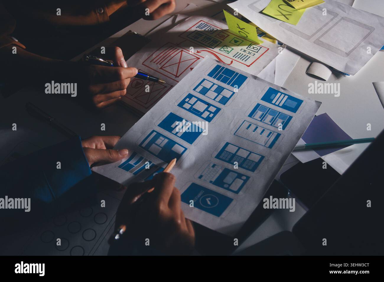 UXUI design brainstorming session with sketches and digital tools Stock Photo
