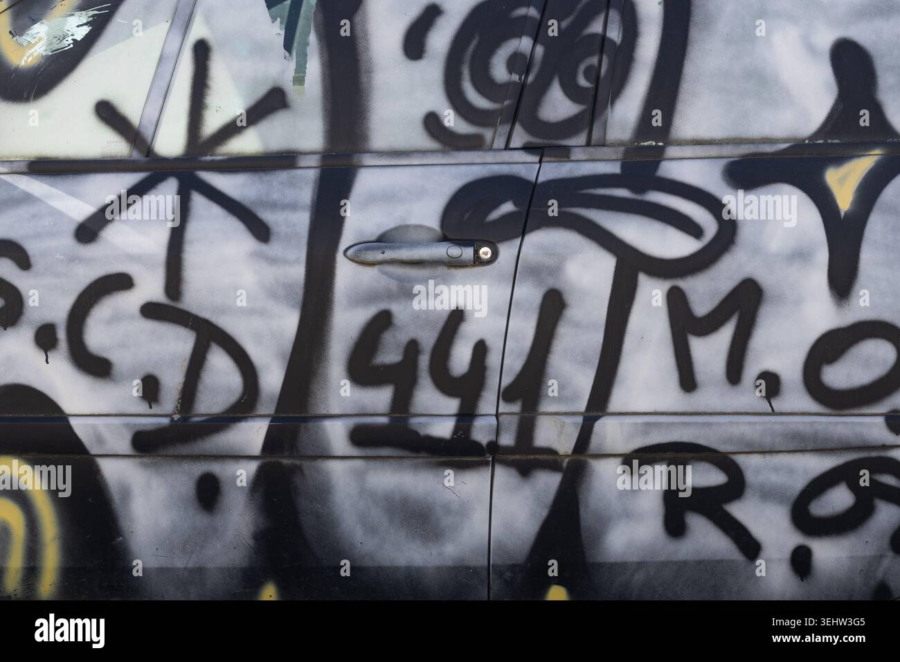 Graffiti Spray Paint on Car Door Stock Photo