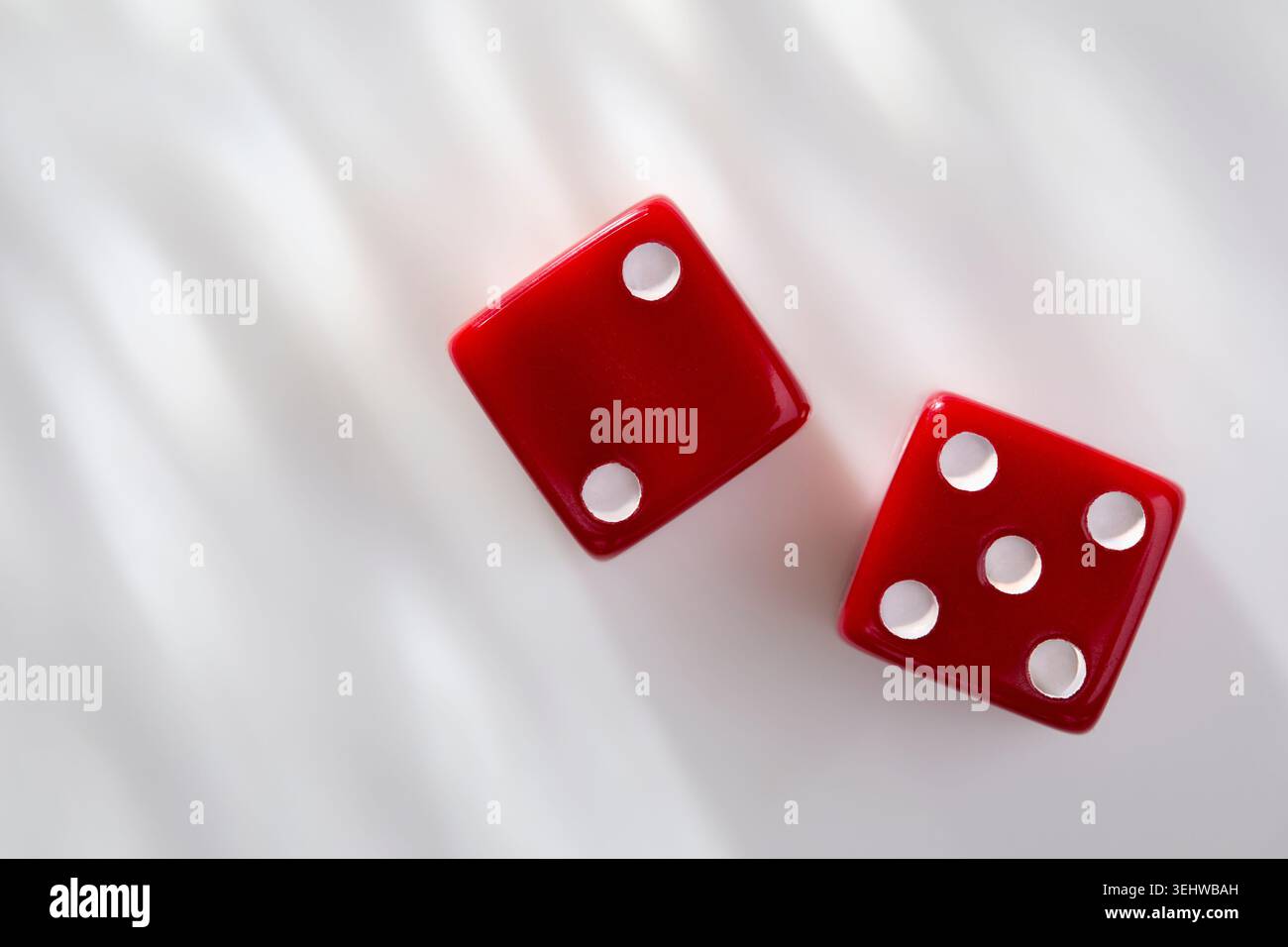 Two red dice on white background Stock Photo