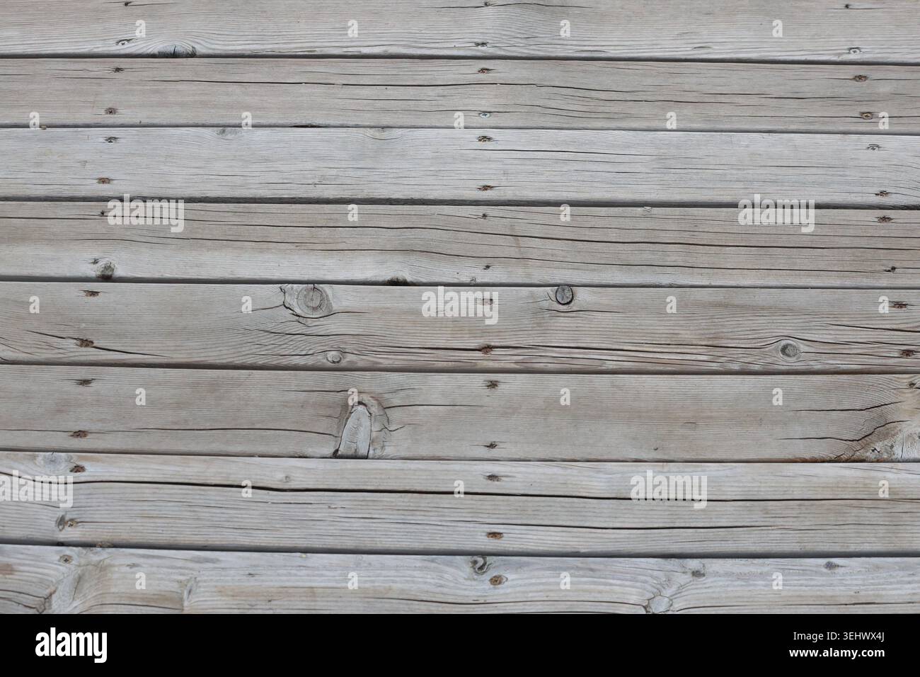 Weathered Gray Wooden Planks Texture with Knots and Nails Stock Photo