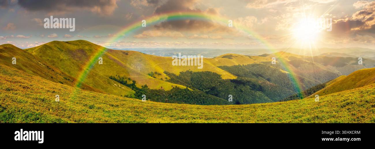 beautiful panorama of mountainous landscape at sunset. wide view of cloudy sky over the grassy slope of a mountain ridge. lovely summer weather with r Stock Photo