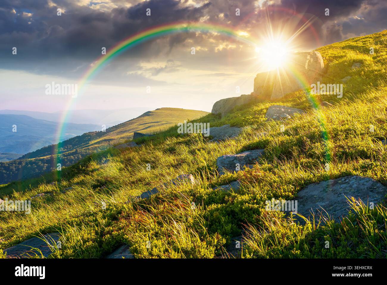 sunset over mountain landscape in summer. beautiful outdoor scenery of carpathian mountains. grassy slopes with rocks. image for ukraine travel backgr Stock Photo