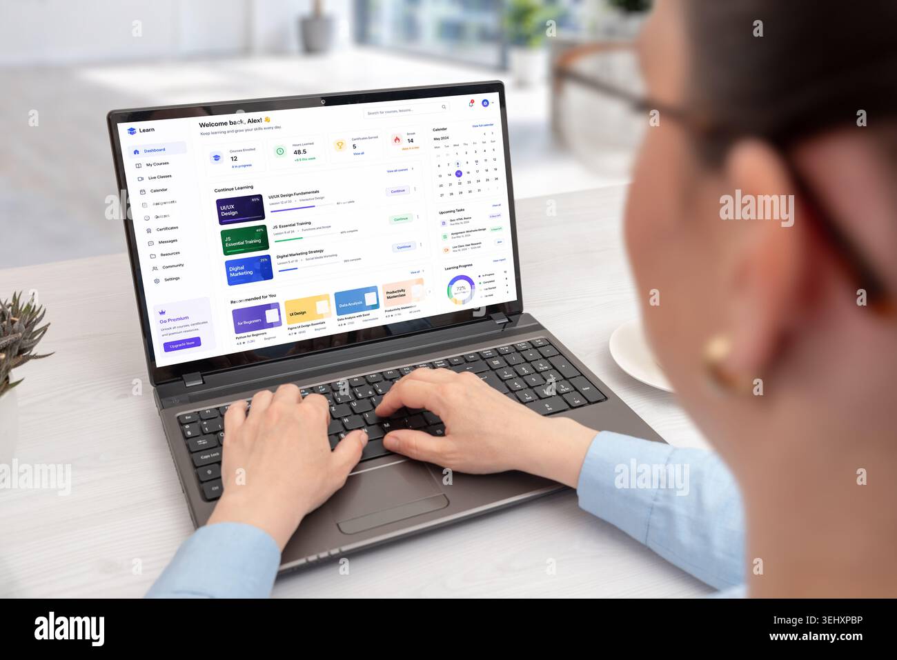 Online learning dashboard displayed on laptop during remote study session, featuring digital courses, productivity widgets and educational analytics i Stock Photo