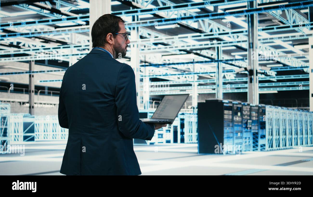 Writing code, laptop program and software developer in data center doing resource optimization. Upgrading IT infrastructure, programming script on notebook worker walking in server hub, camera A Stock Photo