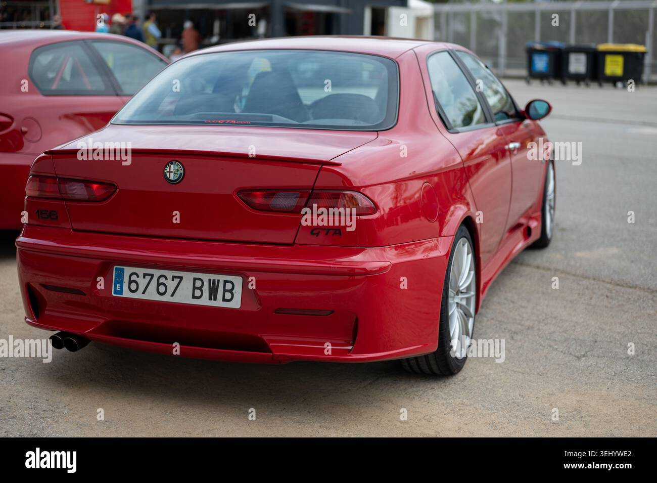 Rear three quarter view of a red Alfa Romeo 156 GTA sports sedan parked ...