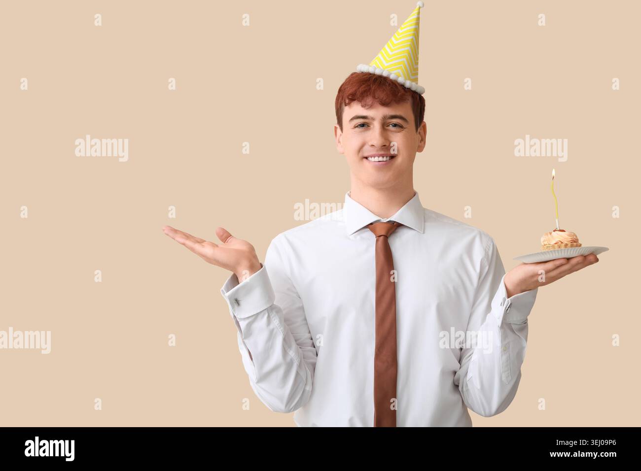 Young man with piece of birthday cake on beige background Stock Photo ...
