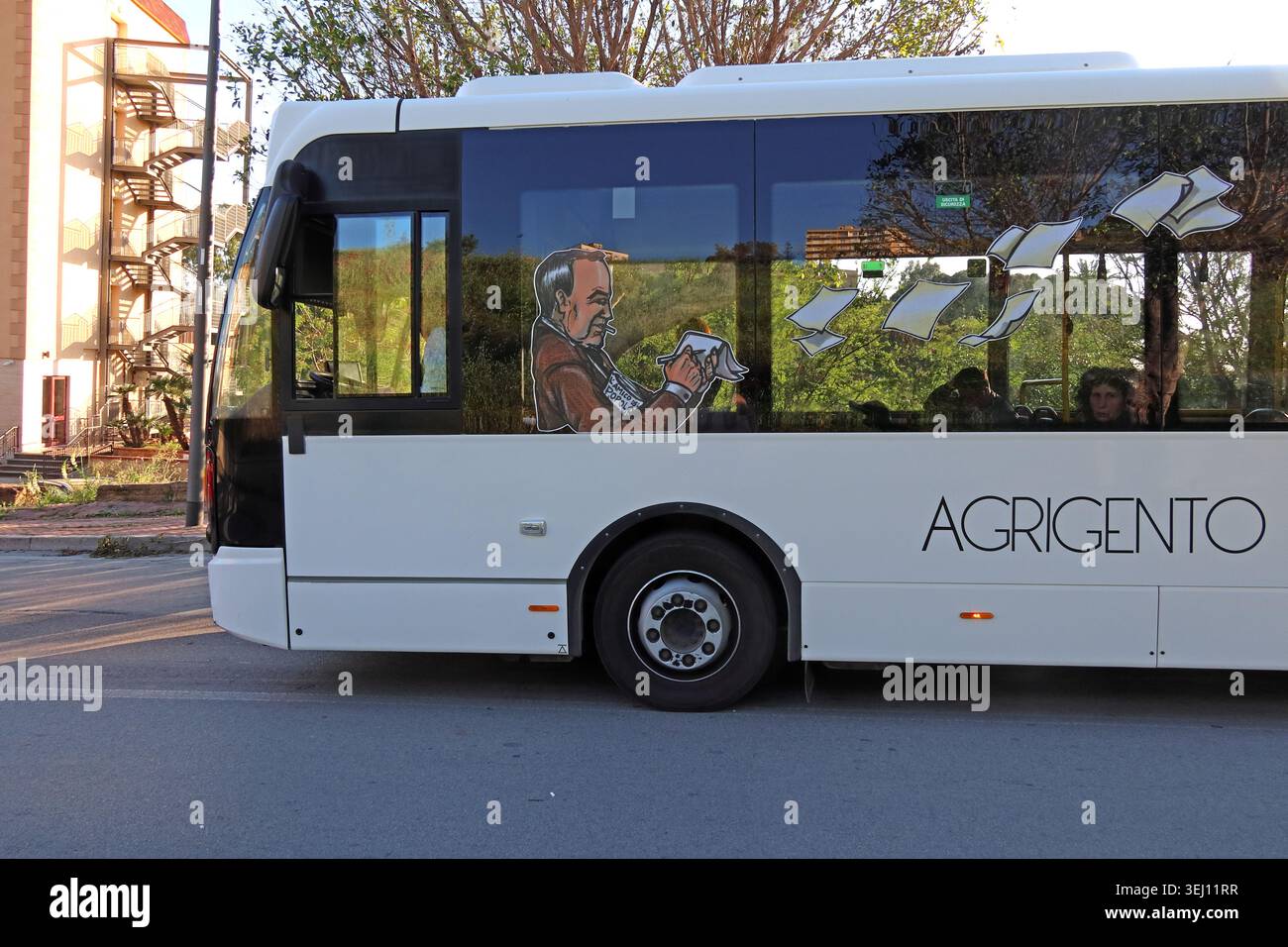 TUA urban bus in Agrigento branded for Agrigento Italian Capital of Culture, Sicily, Italy, side view. Stock Photo