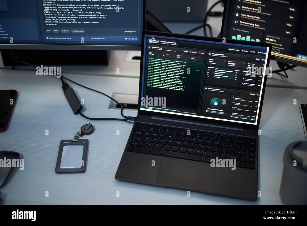 Close up of laptop displaying cybersecurity dashboard and network monitoring data on office desk. Illustrating IT operations, data protection, threat detection, enterprise security Stock Photo