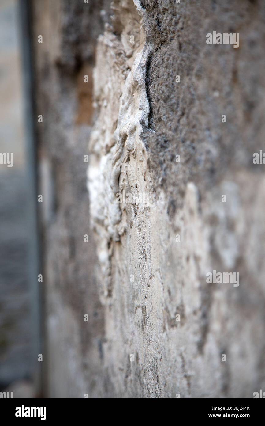 Surface with layered mortar and subtle earthy tones suggesting decay Stock Photo