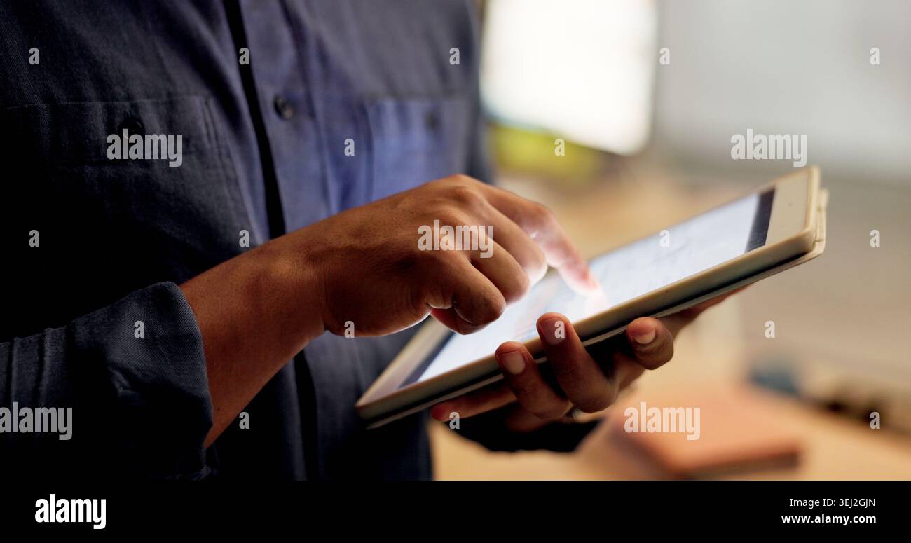 Night, hands and person with tablet in office, planning system maintenance and software development. Tech, overtime and app developer with testing for Stock Photo