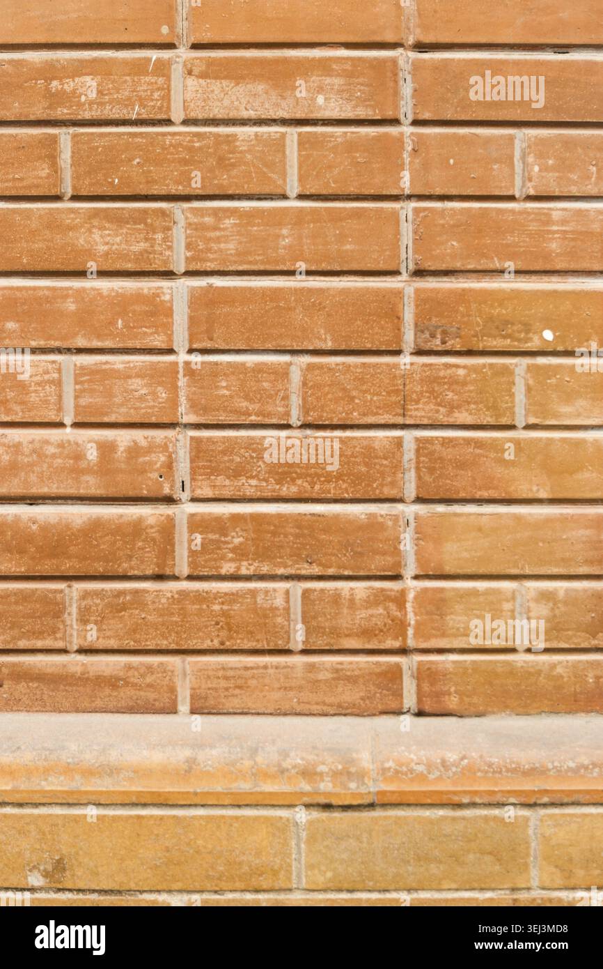 Weathered stained old brick wall background Stock Photo