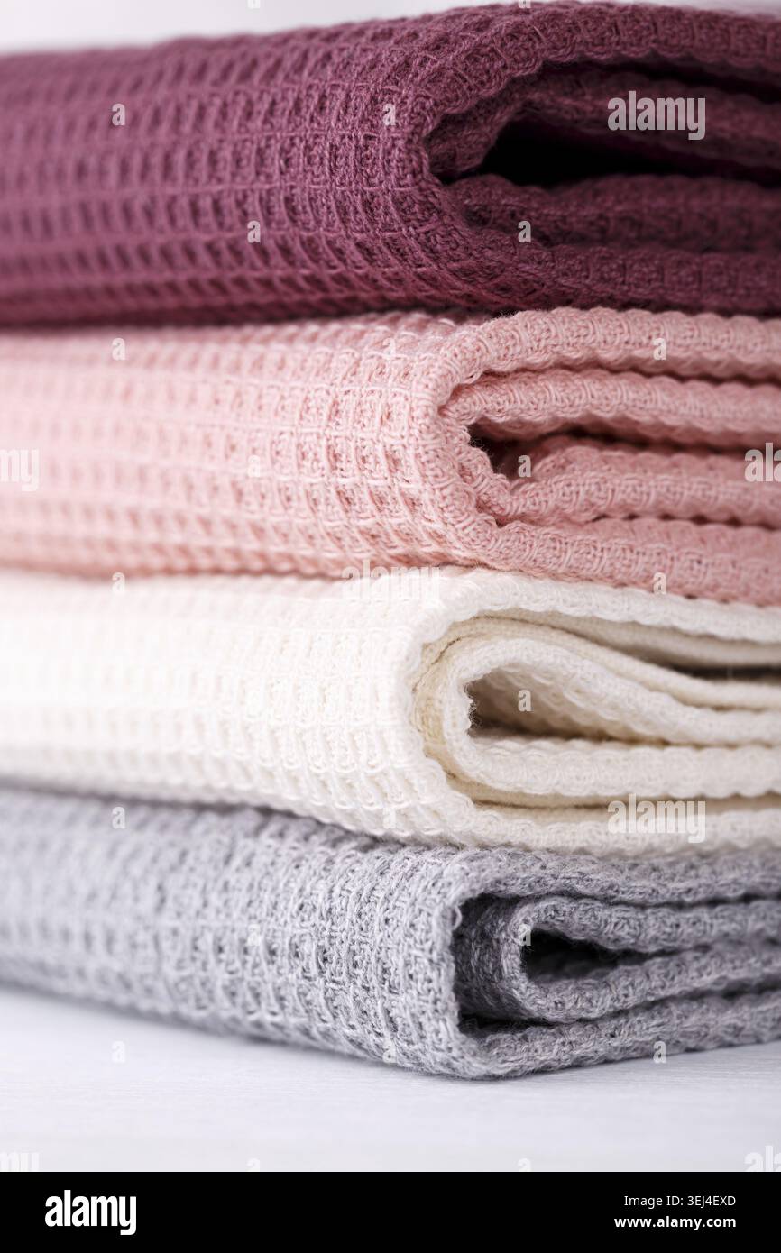 Stack of colorful cotton kitchen towels vertical Stock Photo