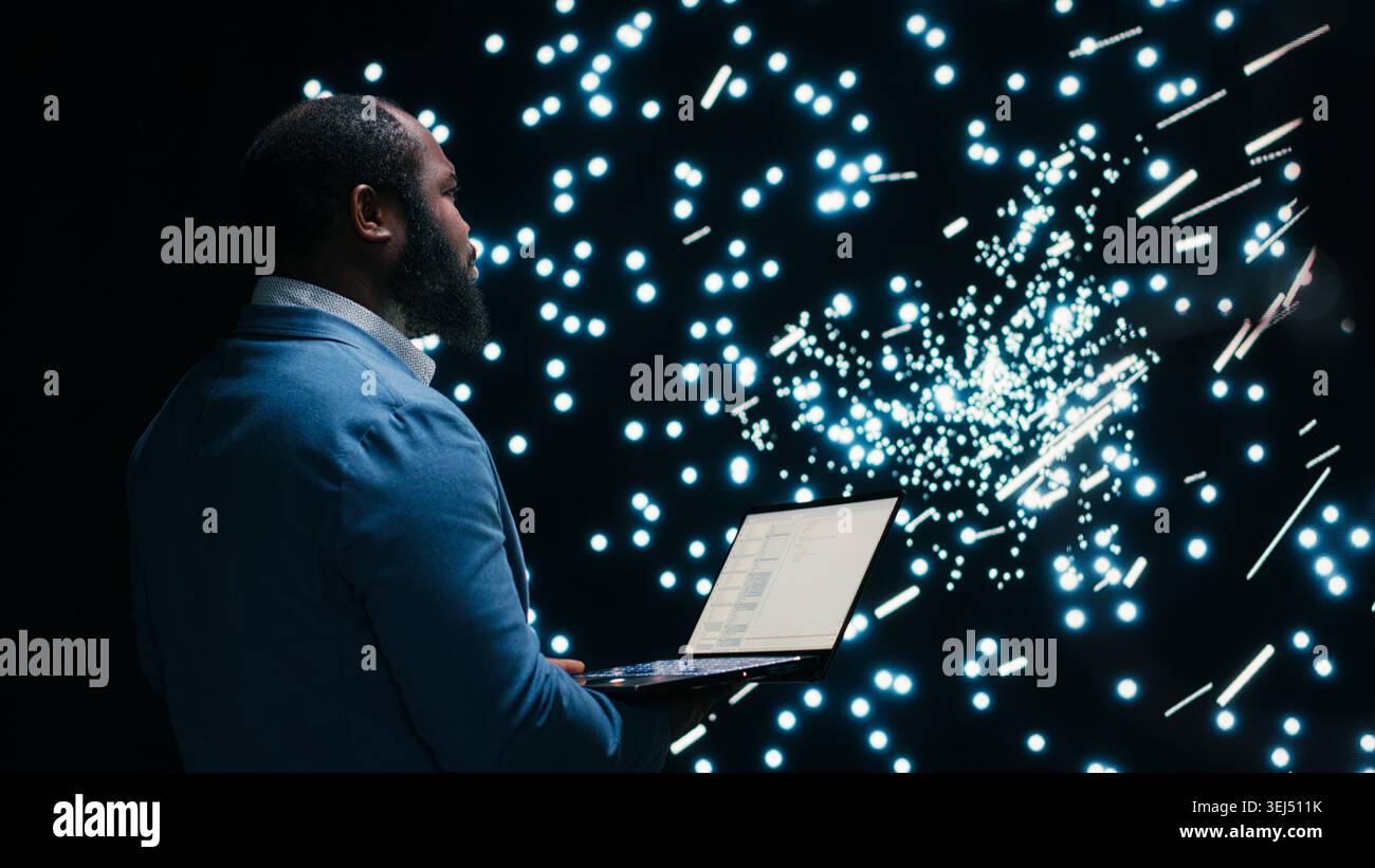 Computer scientist monitoring AI model cognitive systems using AR projection interface. RD tech startup IT expert using augmented reality visualization to study neural network nodes activity, camera B Stock Photo