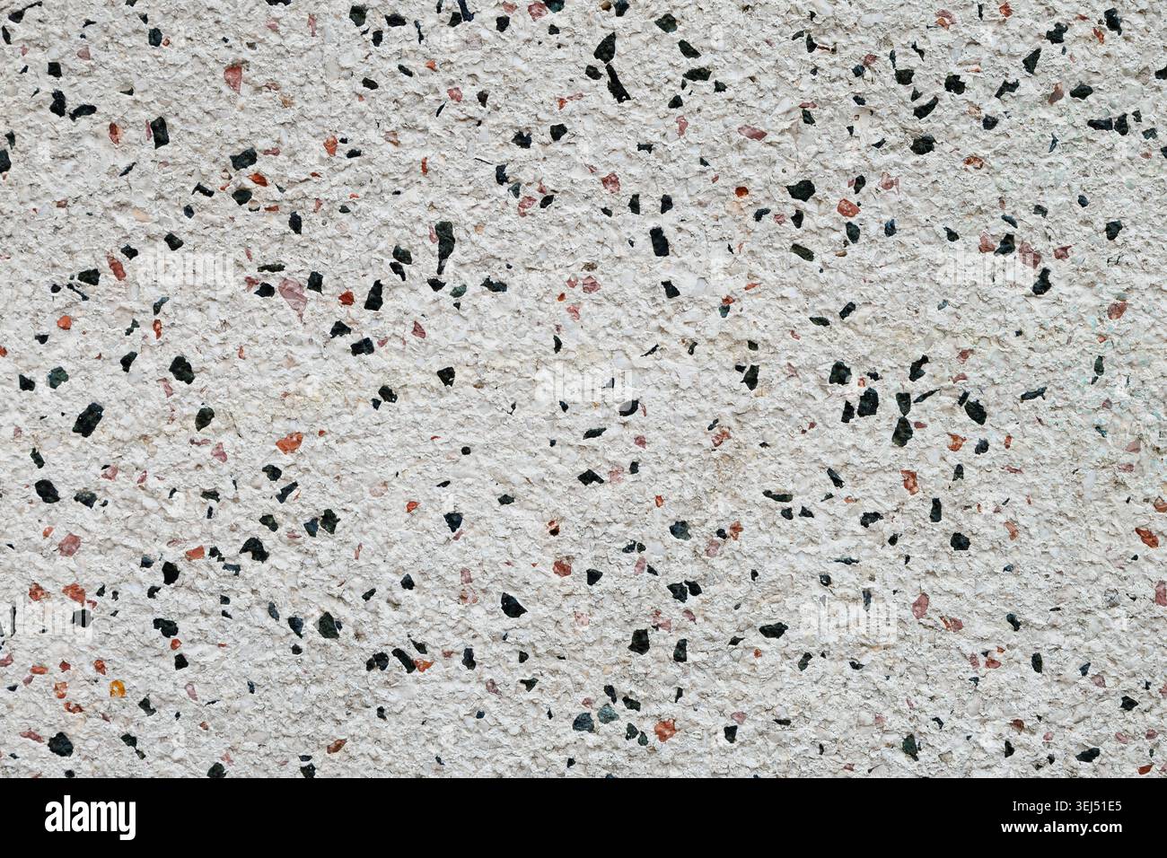 White Terrazzo Wall With Mineral Chips Stock Photo