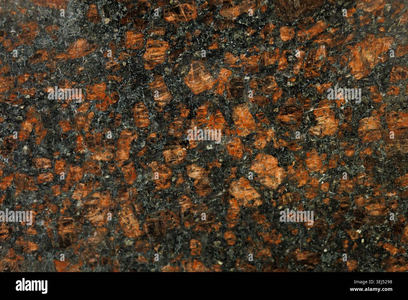 Polished Red and Black Granite Stone Texture Stock Photo
