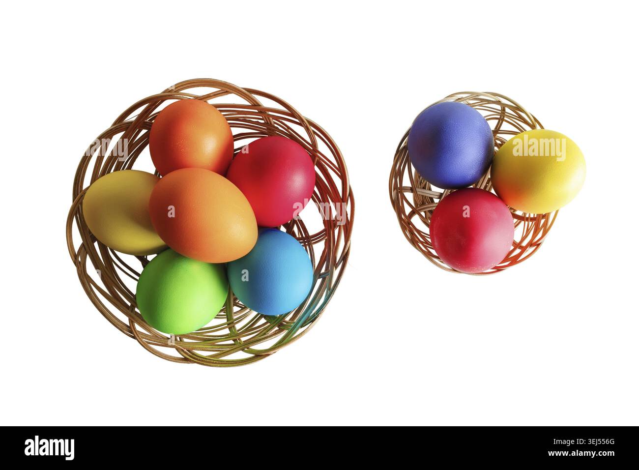 Easter eggs in two wicker baskets. White background. Top view Stock Photo