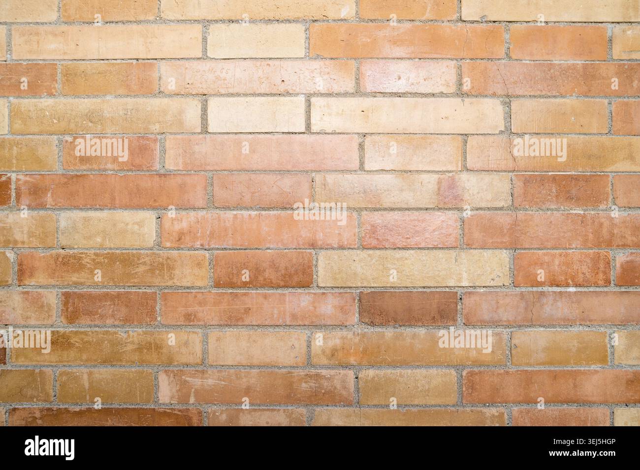 Weathered stained old brick wall background Stock Photo