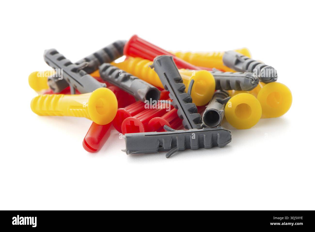 Closeup of colorful plastic dowels isolated on white background Stock Photo
