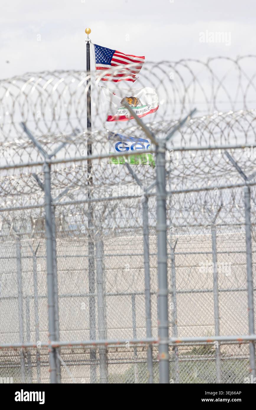 Flags from the U.S., California and GEO fly at the Adelanto ICE ...