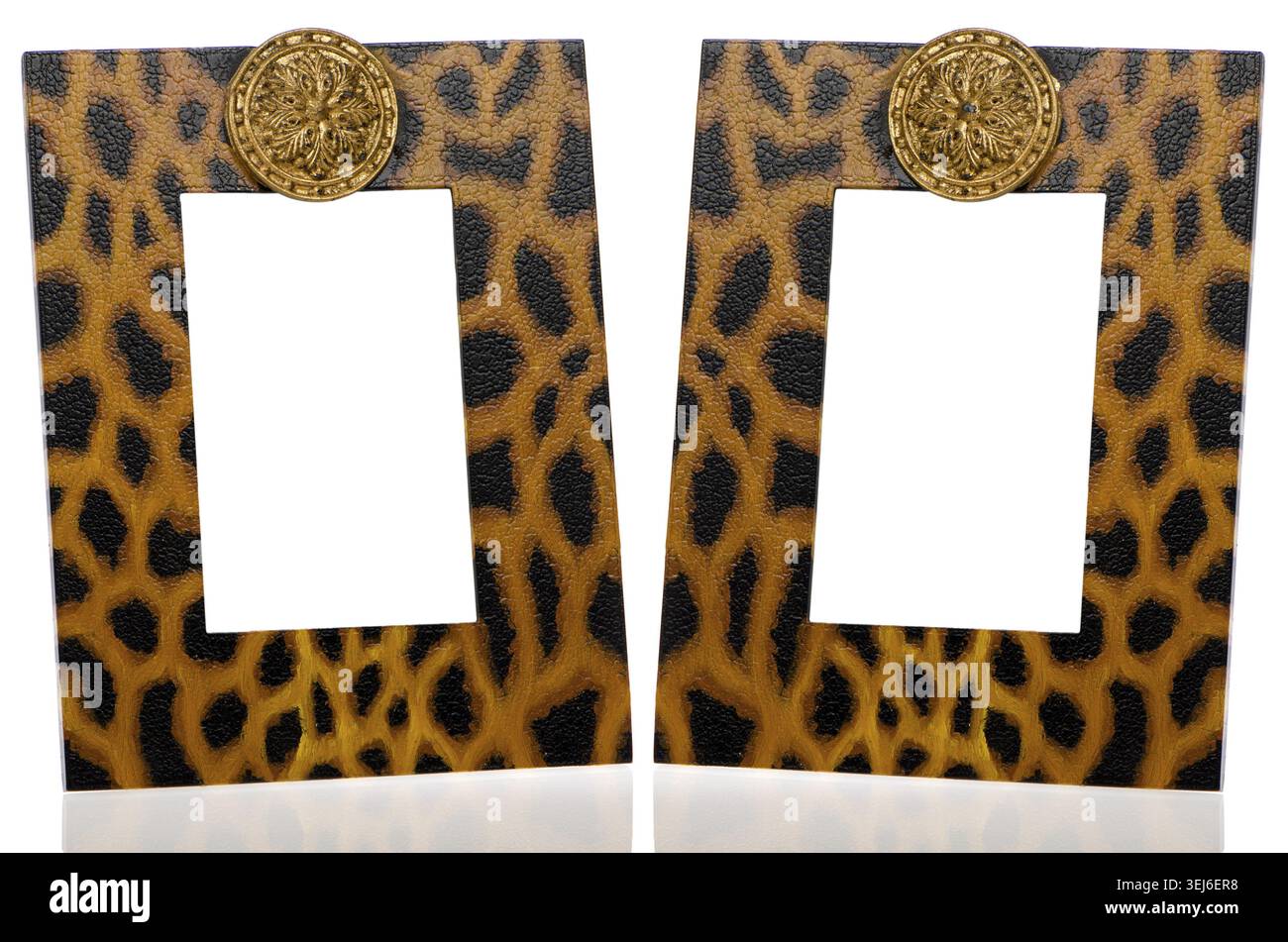 Two photo frames with leopard pattern decoration on white reflective background Stock Photo