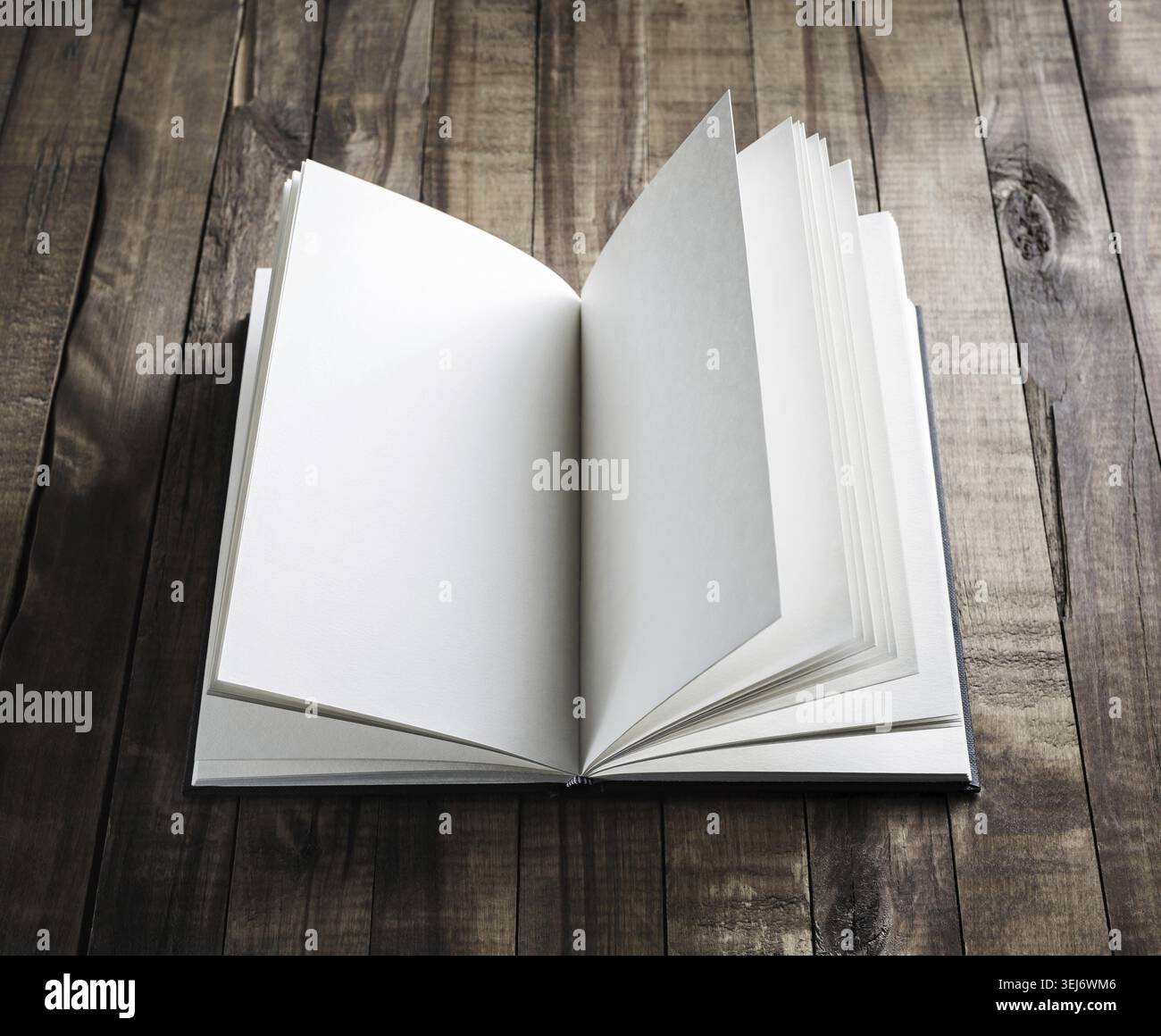 Photo of blank opened book on wooden surface Stock Photo