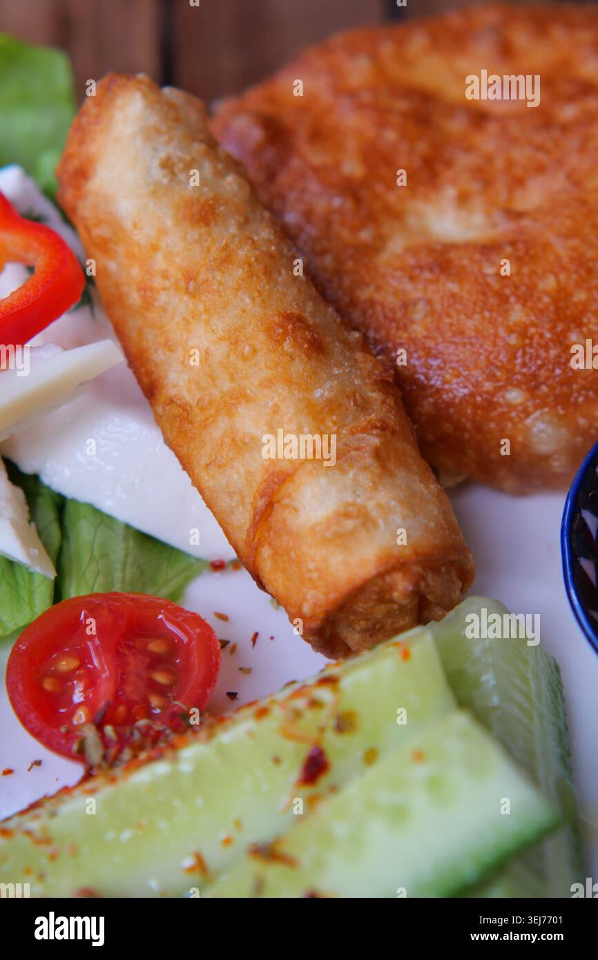 Fresh spring rolls and fried food on a plate Stock Photo