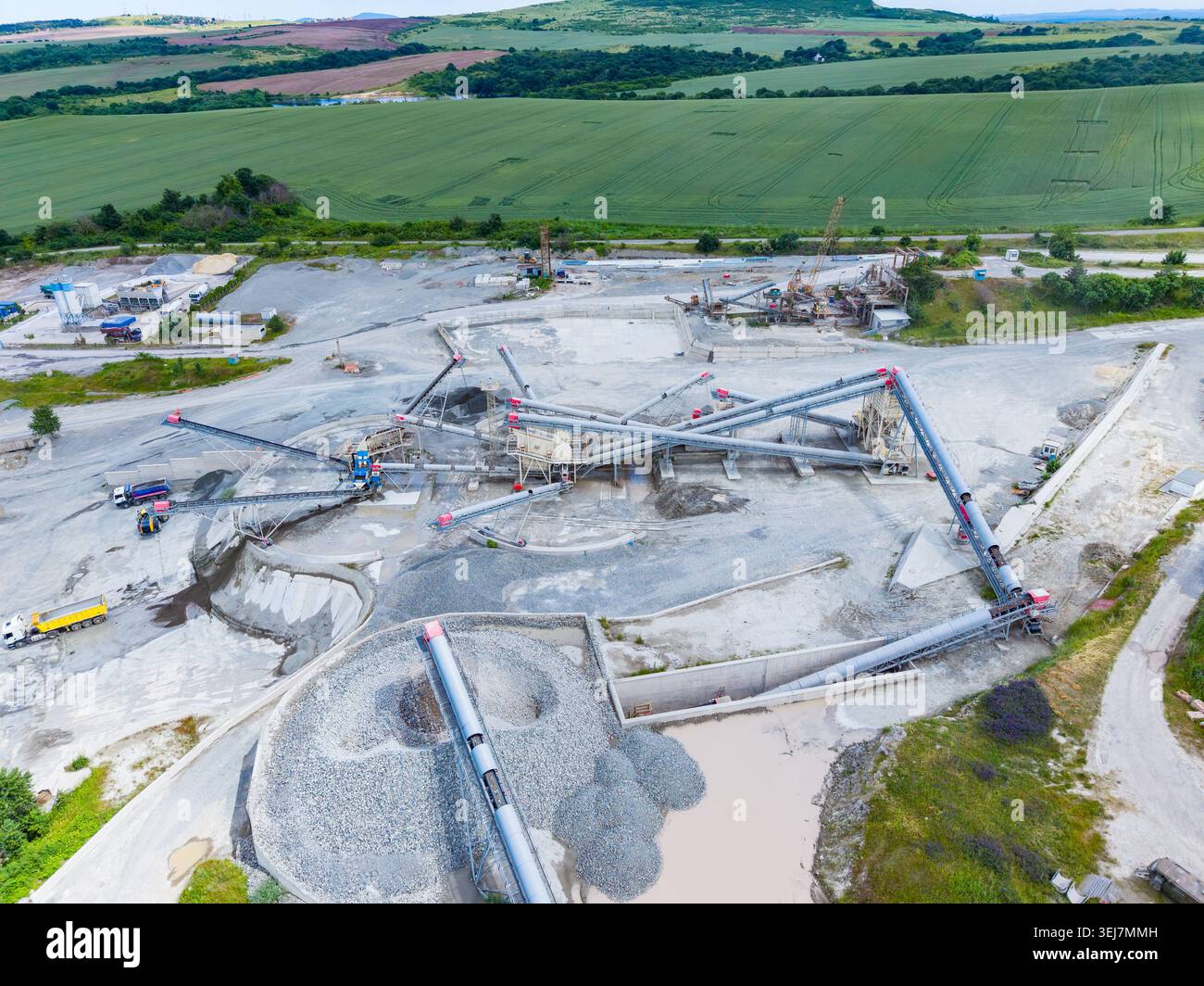 Aerial aggregate plant with conveyors and stockpiles, largescale gravel ...