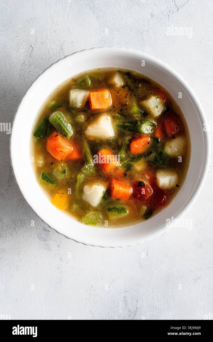 Tomato Software Vegetable soup: some ingredients are potatoes, carrots, green beans ...