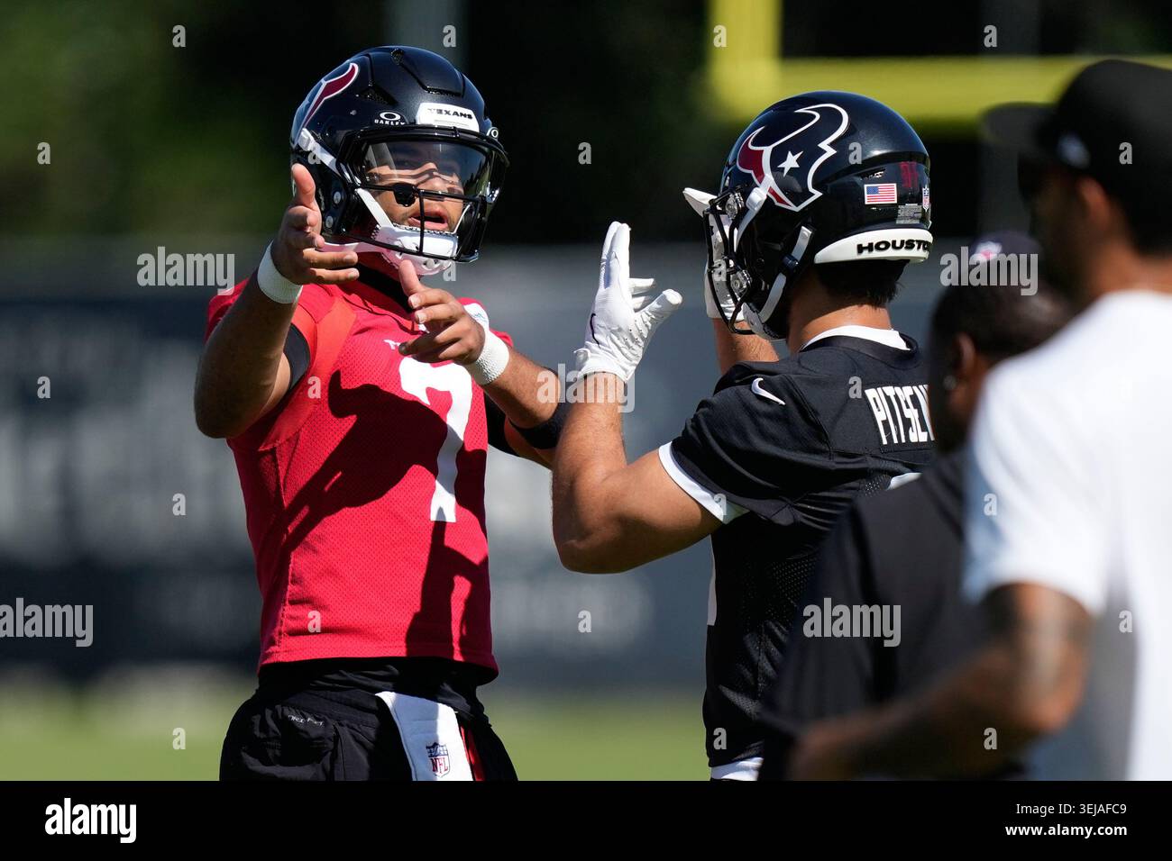 Houston texans quarterback cj stroud greets running back joshua pitsenberger during the nfl football teams practice thursday 