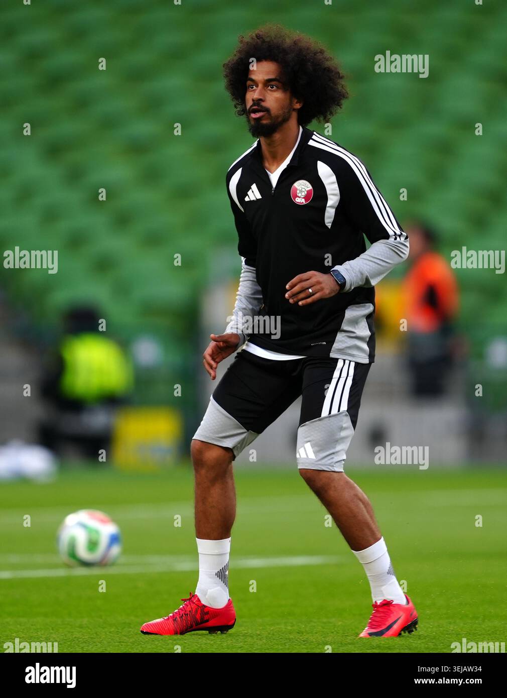 Qatar's Akram Afif warming up ahead of during an international friendly ...