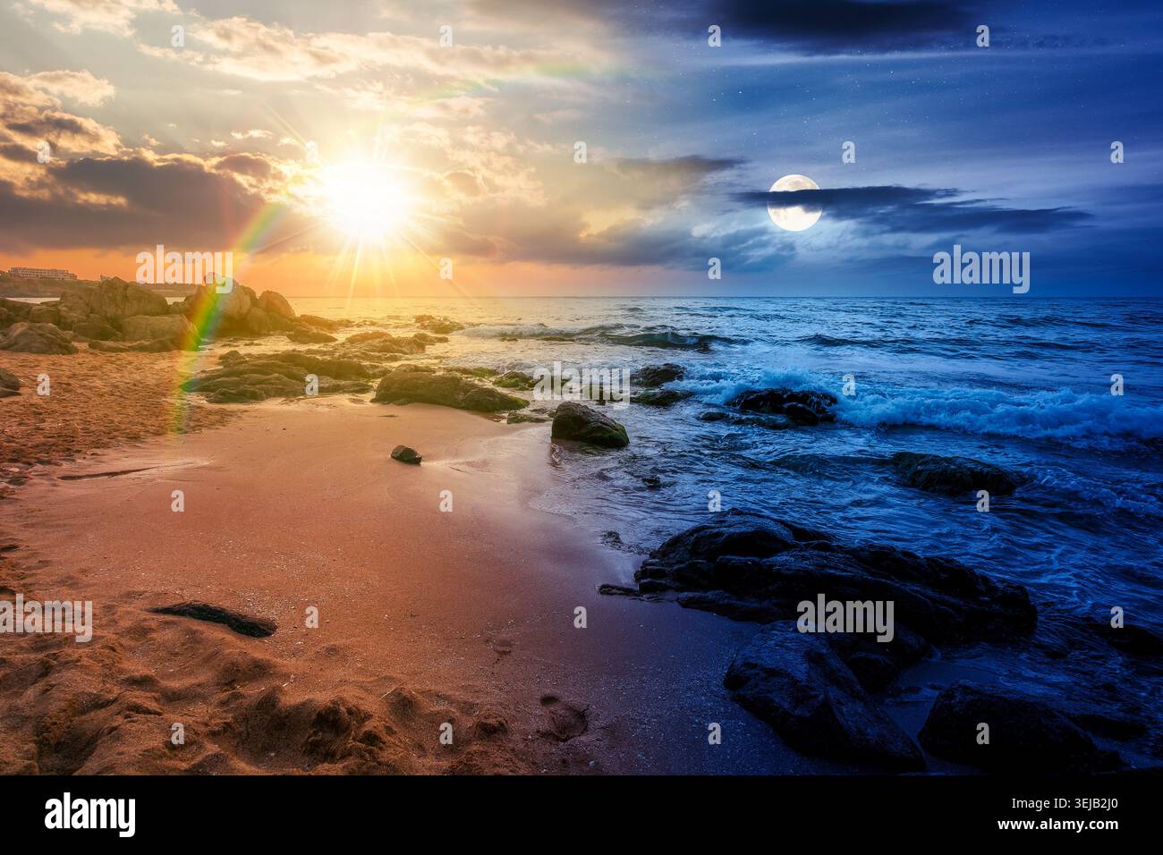 huge stones on a sandy beach. day meet night. epic summer vacation season at the black sea. sun and moon in harmony over calm waves washing the sand s Stock Photo