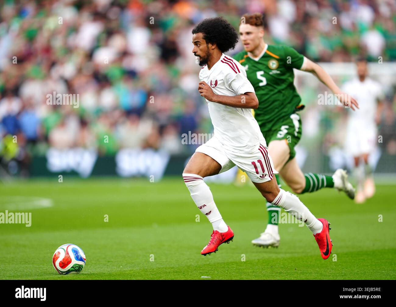 Qatar's Akram Afif and Republic of Ireland's Jake O'Brien during an ...