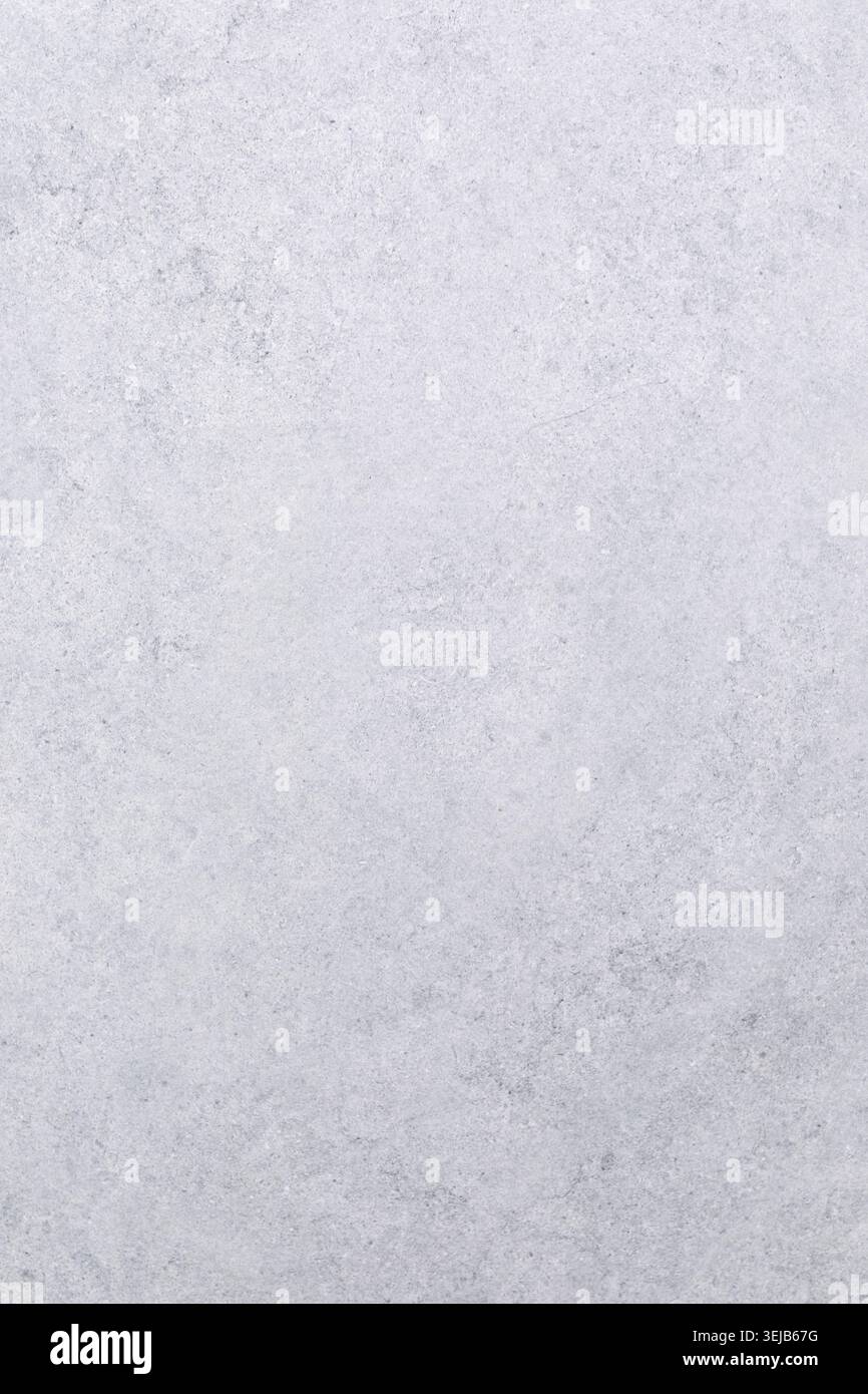 A smooth, light gray stone surface features subtle textures and patterns, perfect for various design projects, backgrounds, or crafting activities. Id Stock Photo