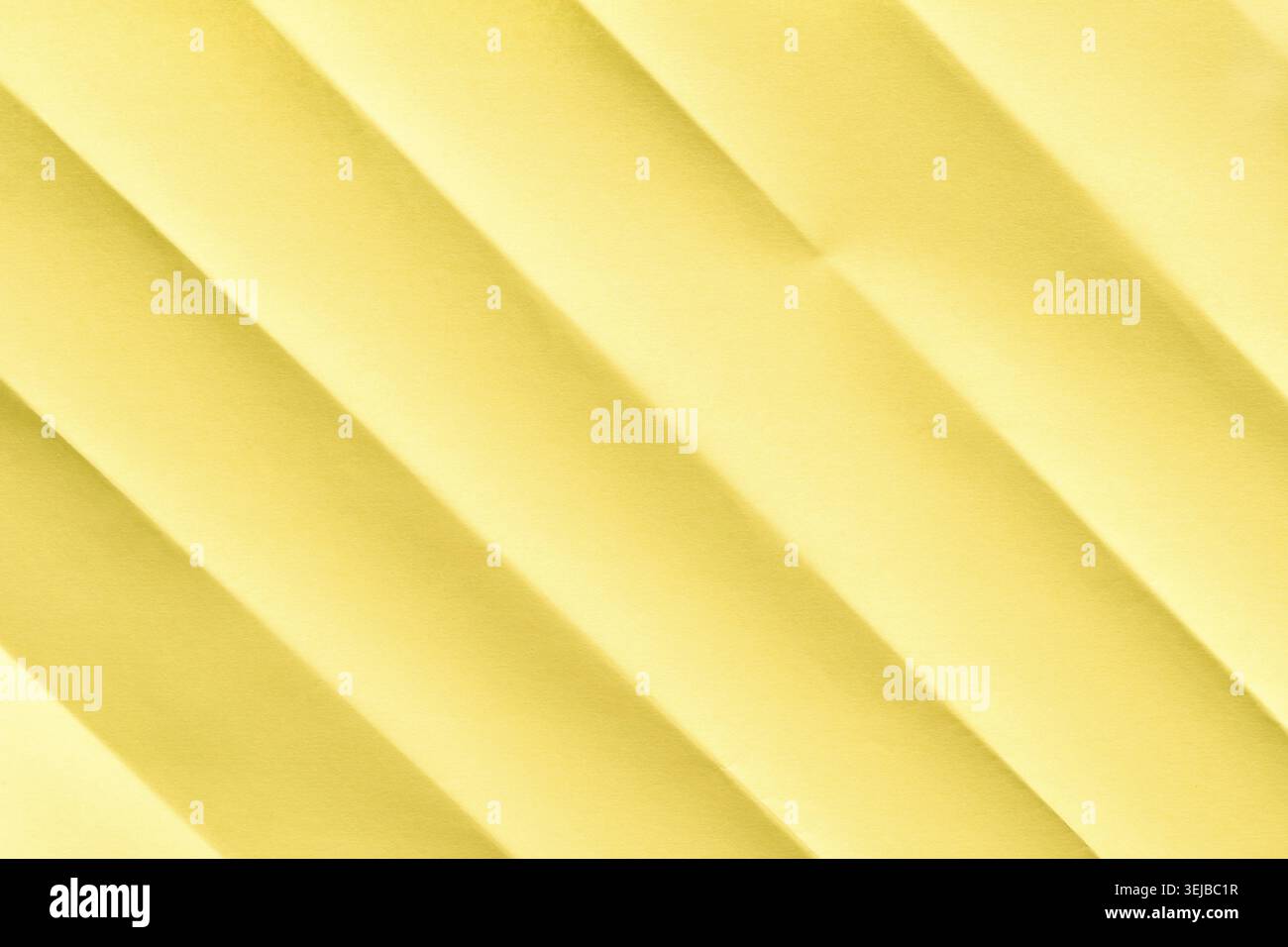 Yellow textured abstract background with diagonal lines and soft shadows Stock Photo