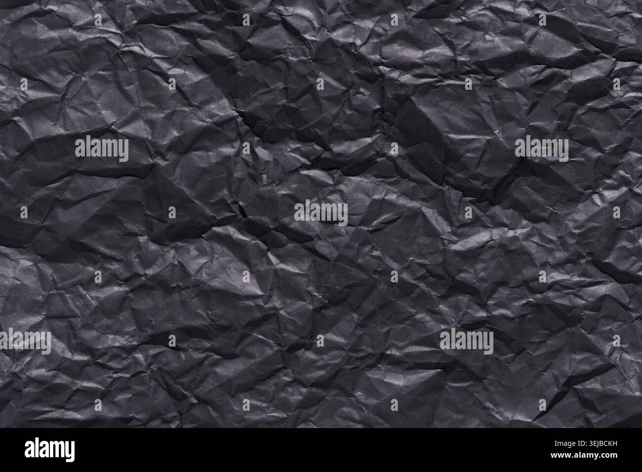 Crumpled black paper texture background for creative design and art projects Stock Photo