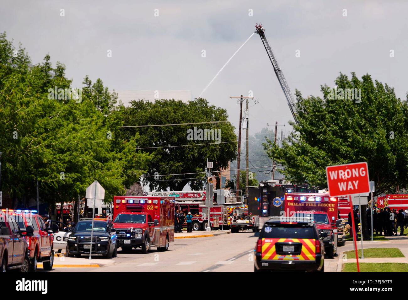 Police and firefighting crews respond to the scene of a large fire at ...