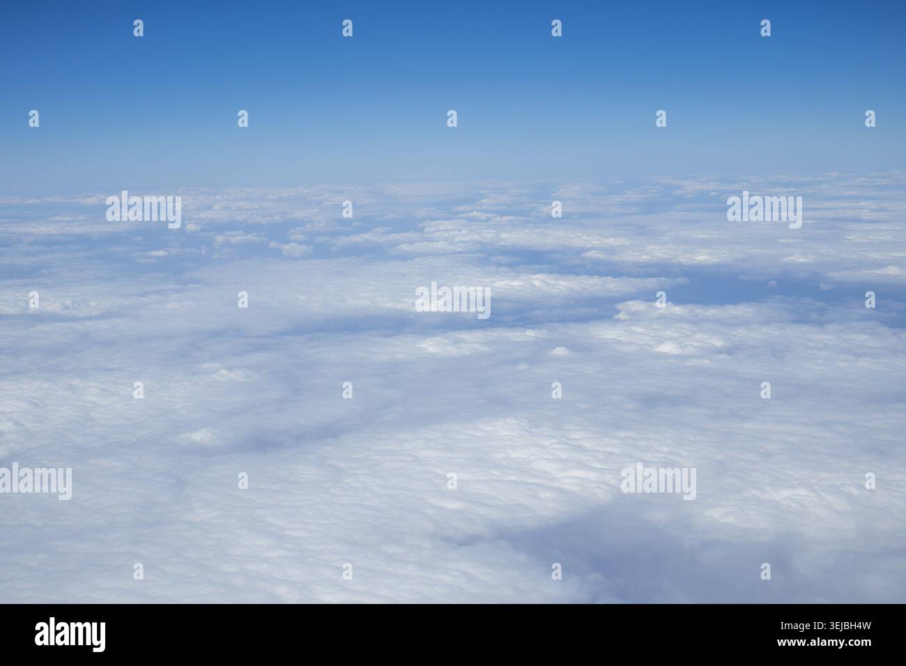 Soft White Clouds Viewed From Airplane Above The Sky During Flight. Stock Photo