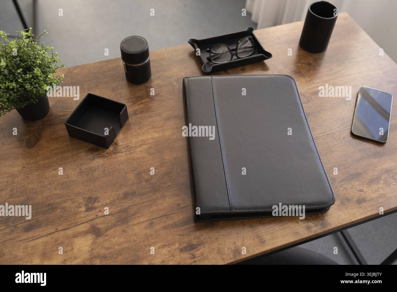 Leather folder for documents on the desktop in brown color Stock Photo