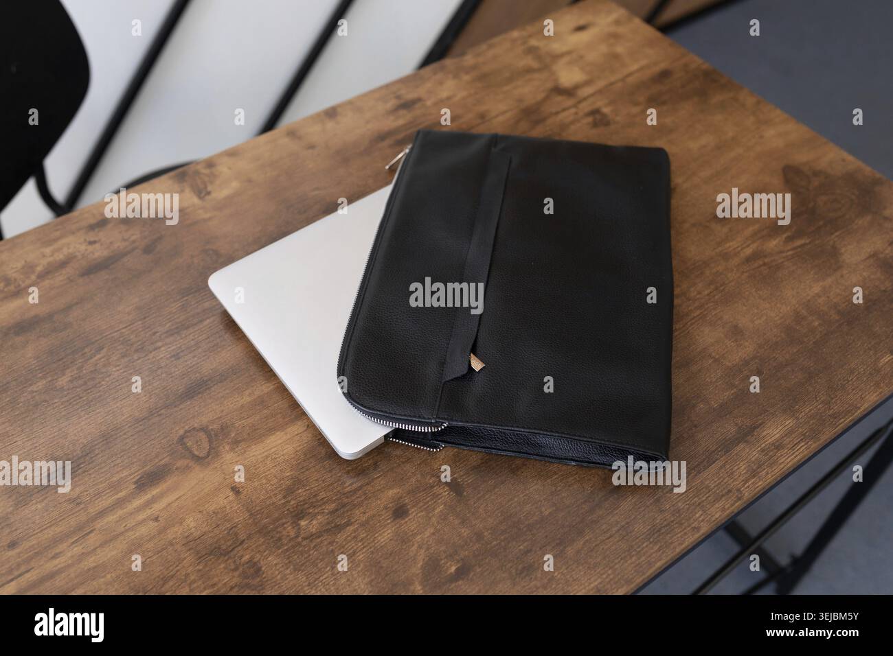 Leather folder laptop case on the table Stock Photo