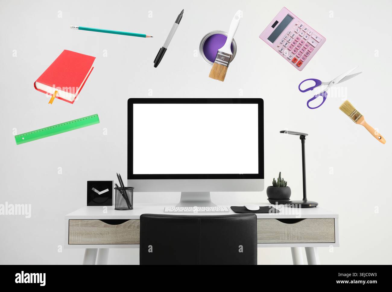 Web design tools flying around computer. Creative designer workspace Stock Photo